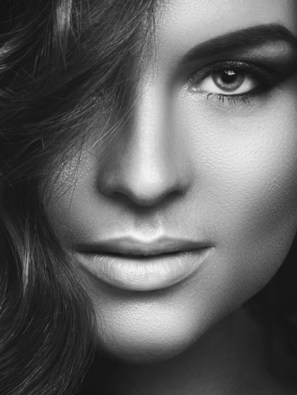 Portrait of Woman with curly hair and beautiful make-up